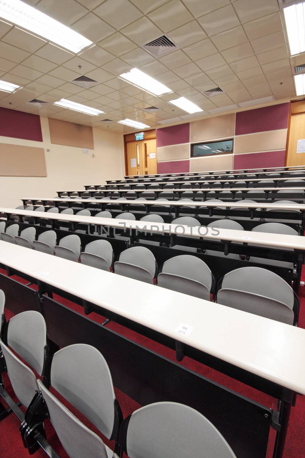 Empty hall for presentation with grey armchairs  by cozyta