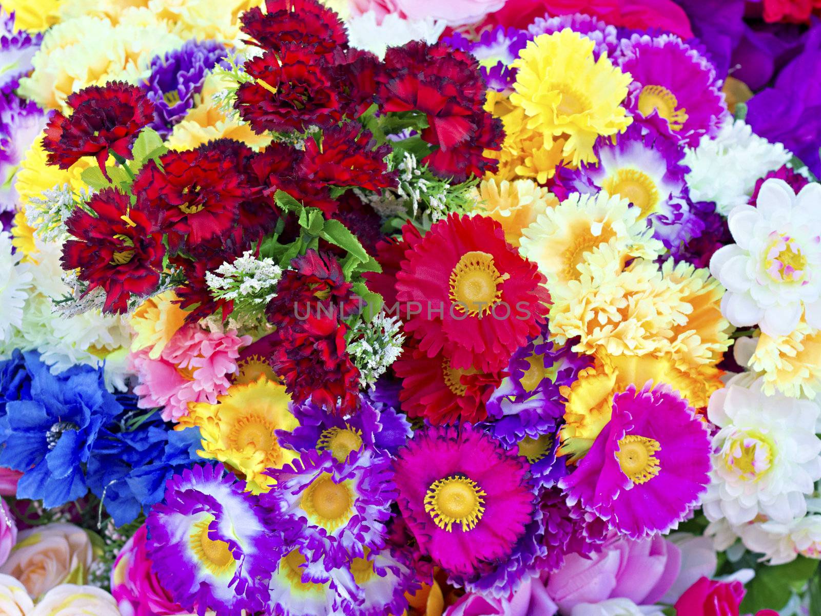 background of colorful artificial flowers