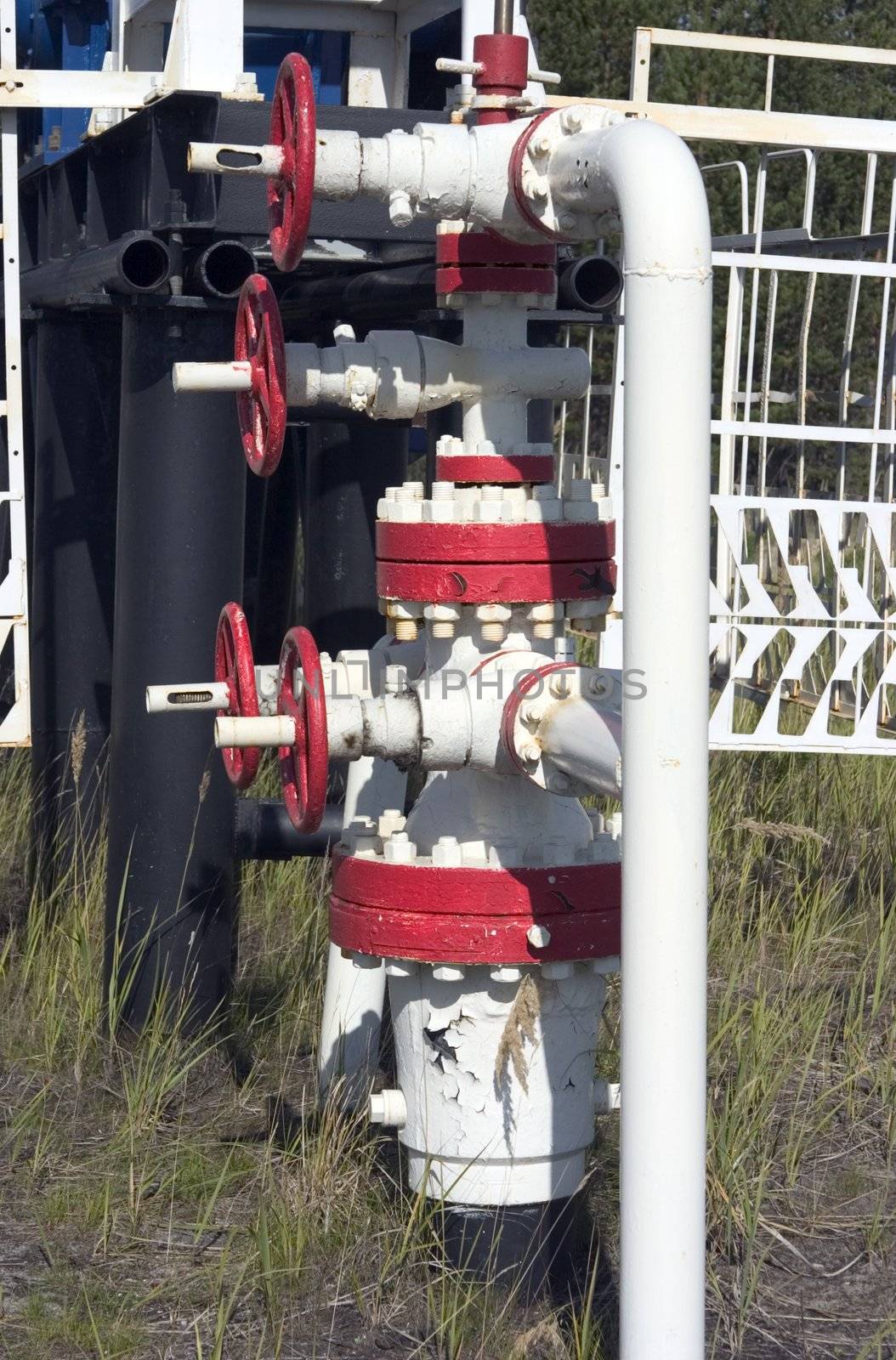 bound white fuel pipes with the red gates, making industrial system