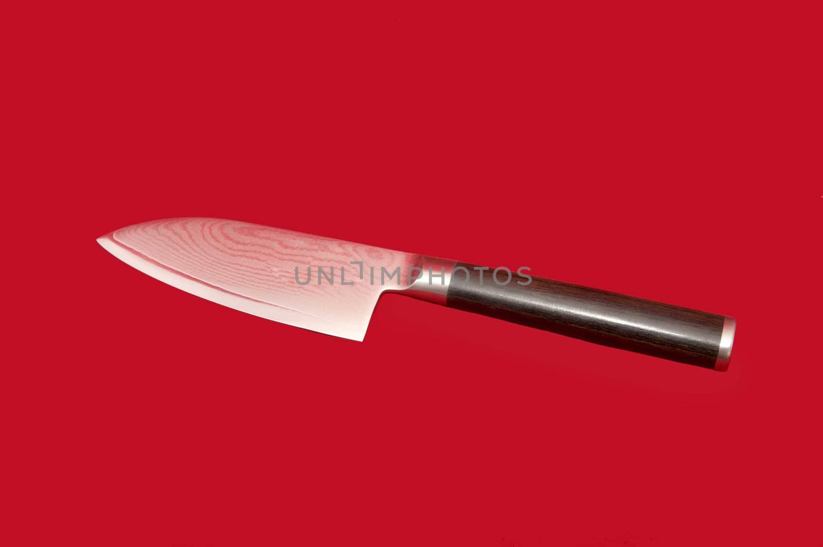 Bread knife on a red background