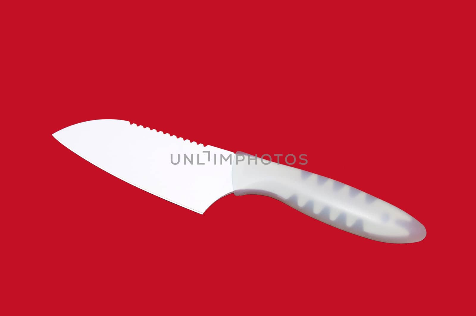 butcher knife with a ceramic coating on a red background