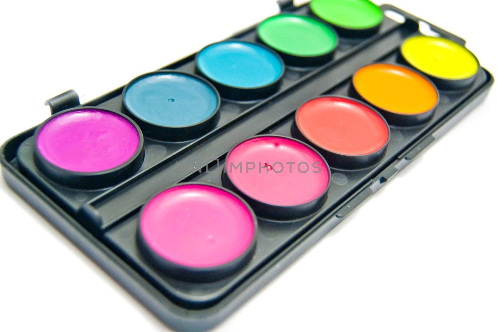 box of colorful paints on white background