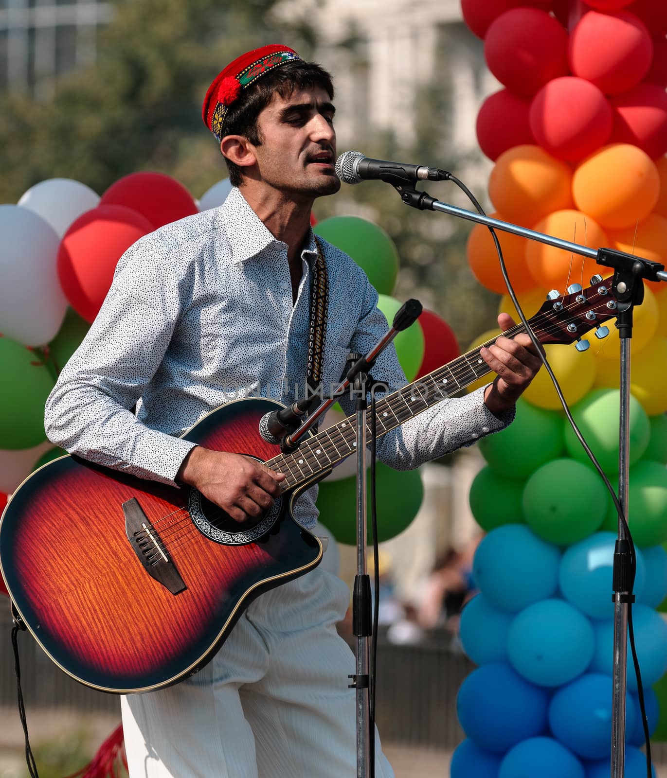 August 30st, 2011 - The annual celebration of Tatarstan Republic Day in Kazan is a colourful event, where the numerous local ethnics groups in traditional costumes perform in dances and singings. In this picture a Tajik guitar player.