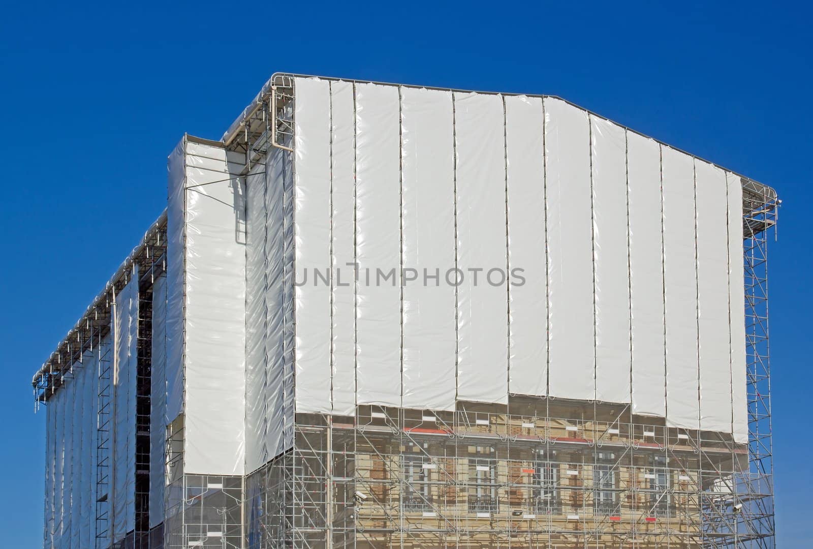 restoration of a castle in the Paris region  white tarpaulin