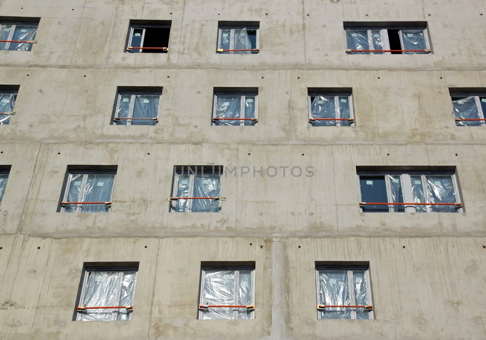 Laying windows, building under construction