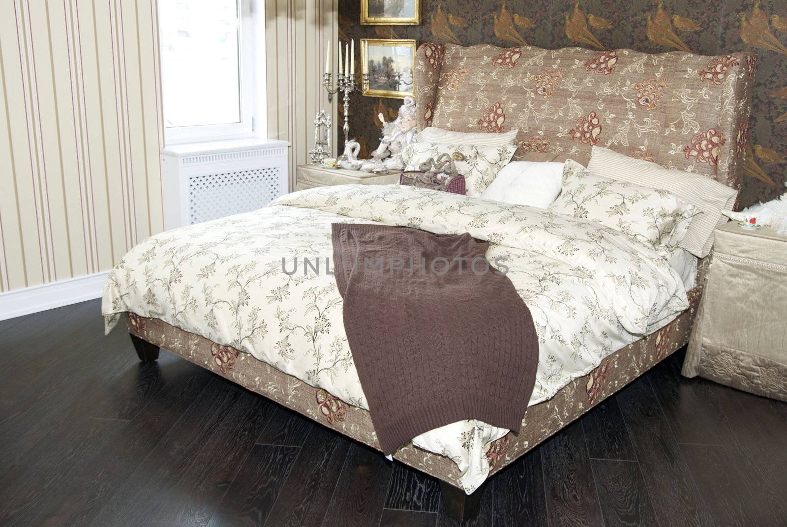 a large comfortable bedroom in the style of the nineteenth century