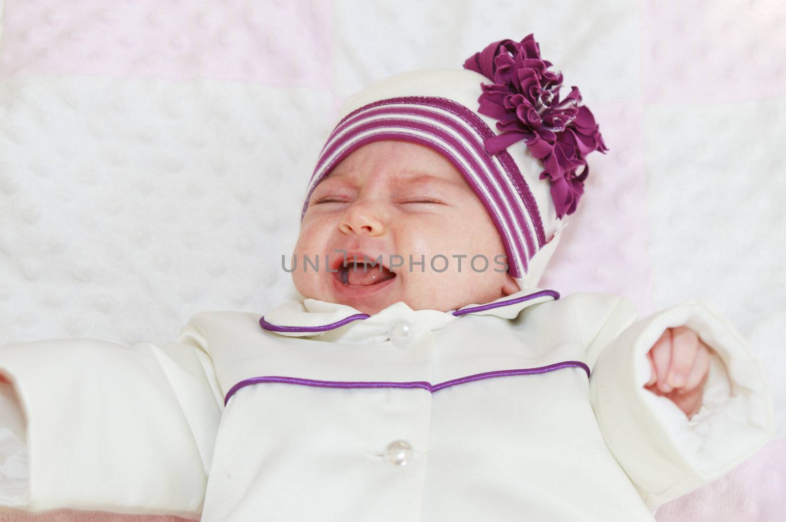 Crying newborn baby girl by manaemedia