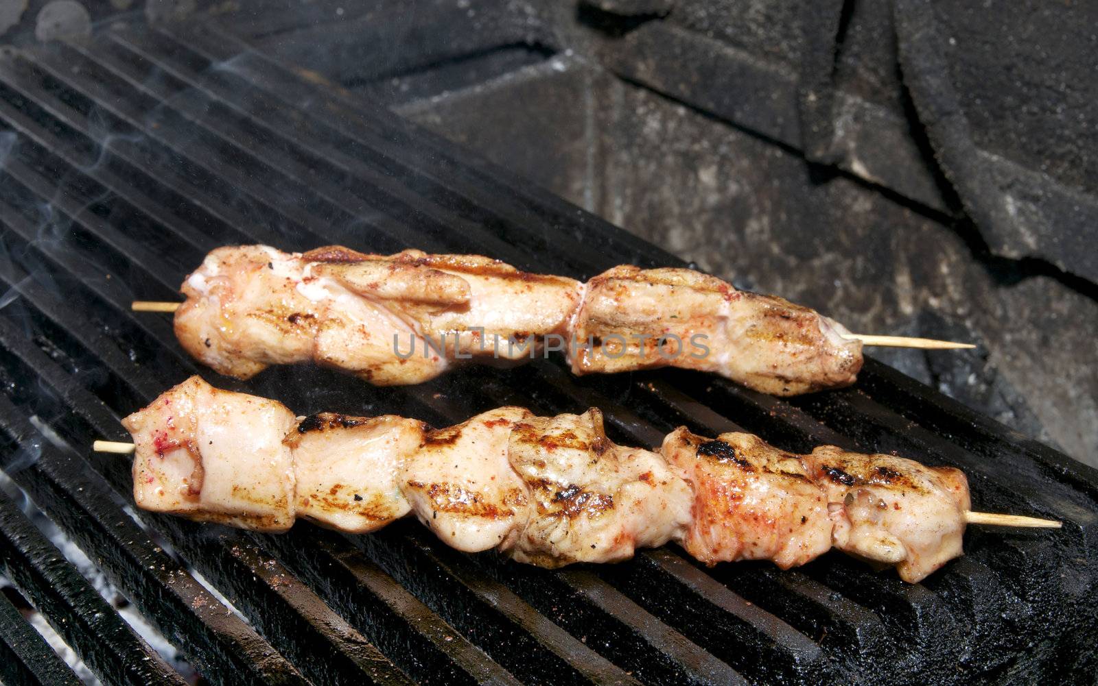 Chicken kebabs on the grill in the restaurant