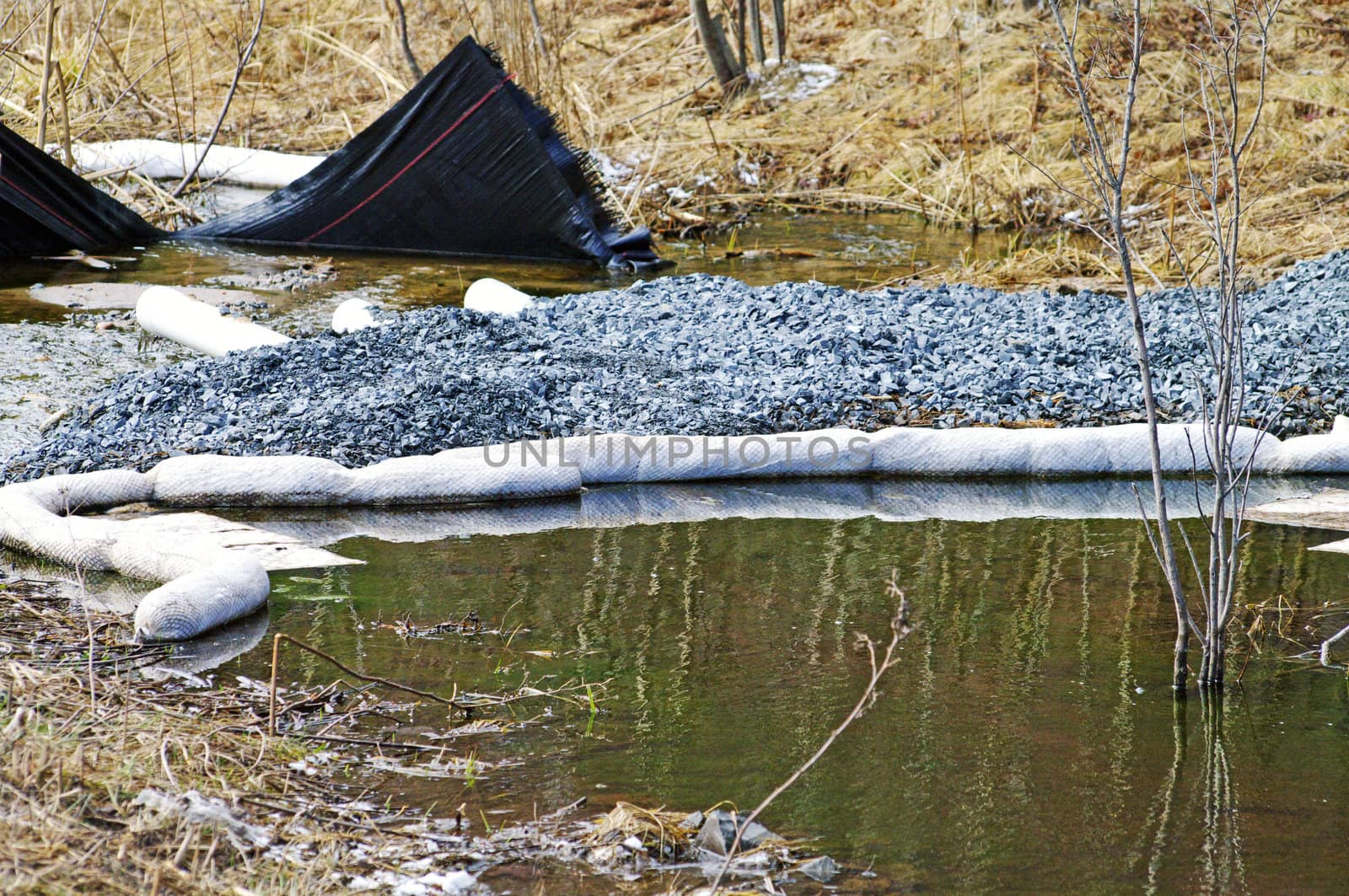 A waterway in the process of being remediated as a result of a vehical accident 