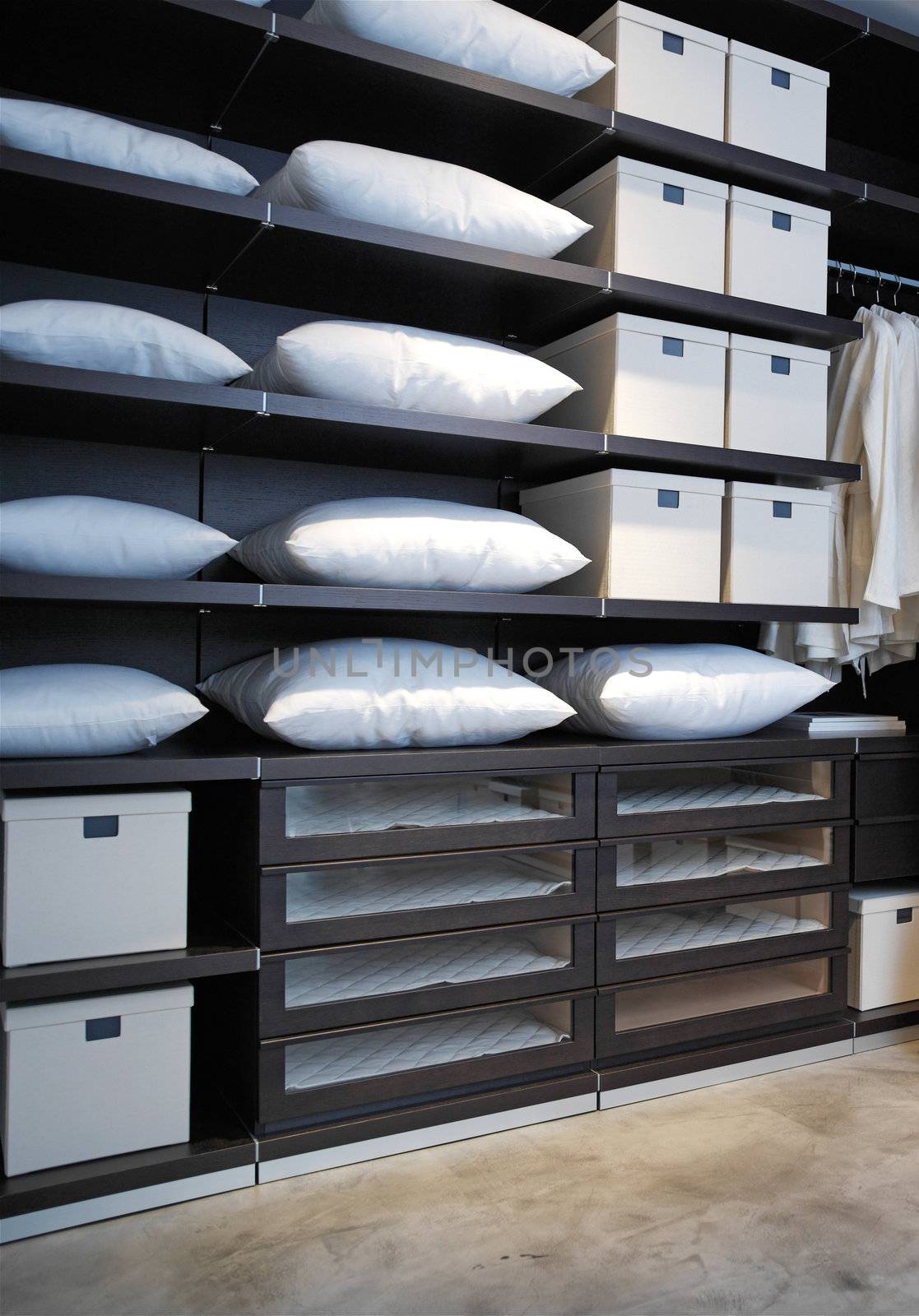 expensive shelving in the boutique with pillows and boxes