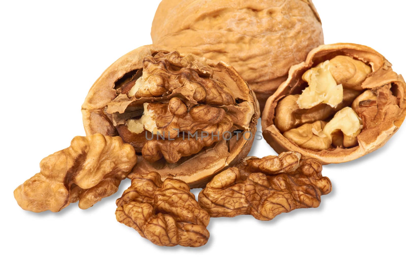 Group of walnuts isolated on white background with light shadow.