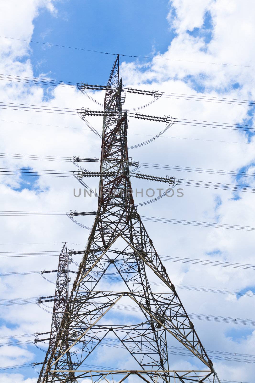 Transmission tower at blue sky by kawing921