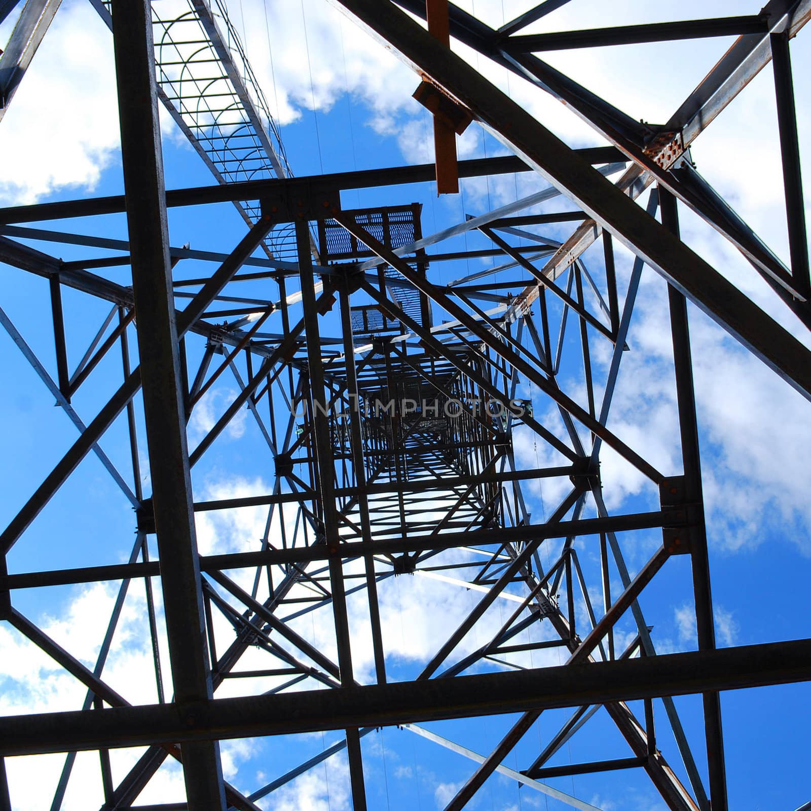 abstract high-voltage tower on blue sky background