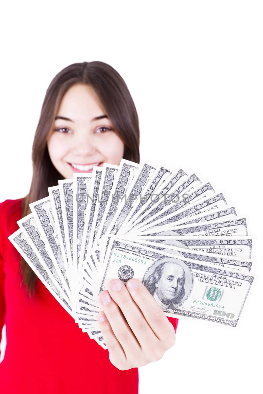 Money In Teenager Hands,  Teenager holding and showing all one hundred dollar banknotes in her red shirt with a sweet smile. Isolated on white background.