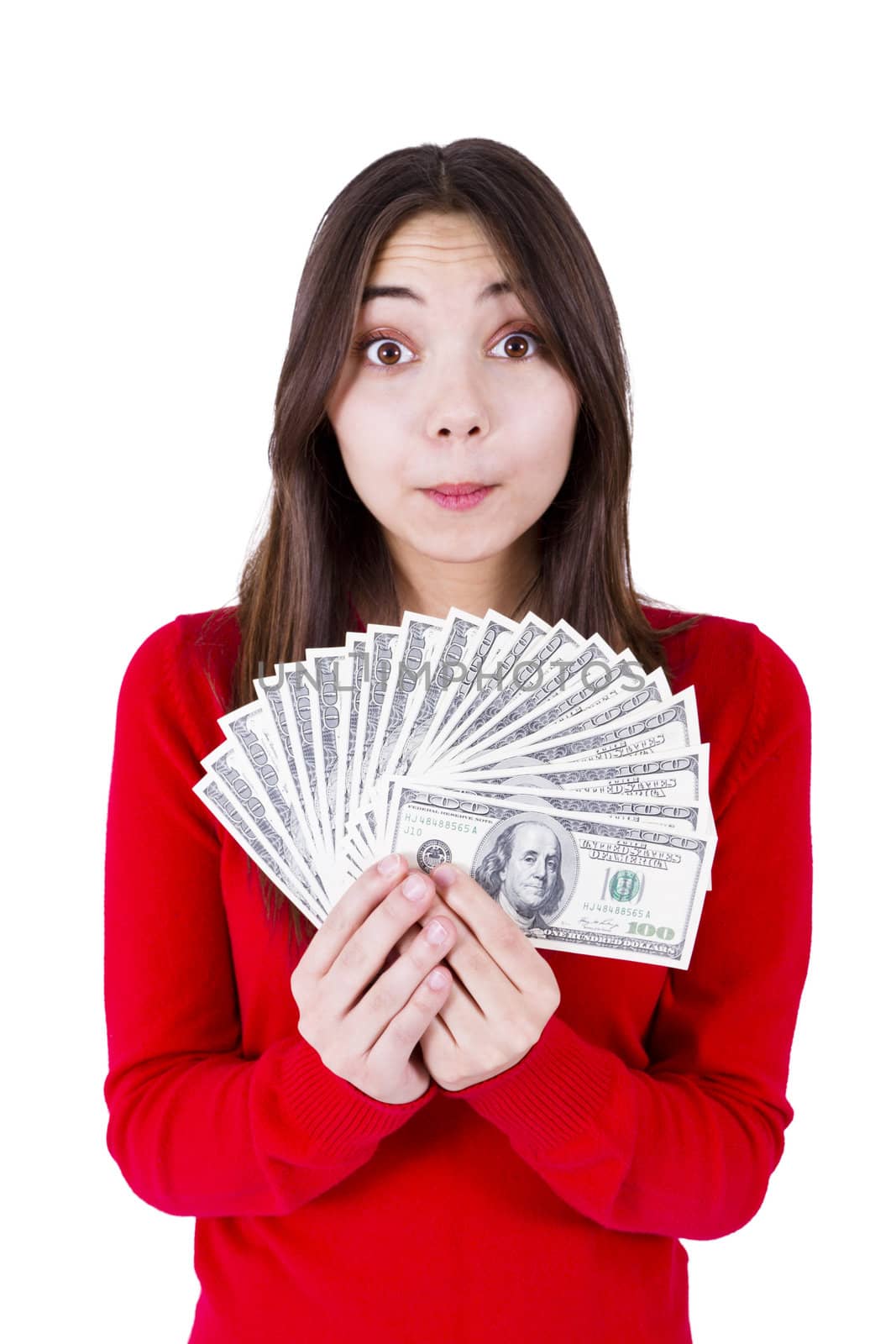 Surprised teenager girl holding her all one hundred dollar banknotes. What am I gonna do all with this money. Isolated on white background.