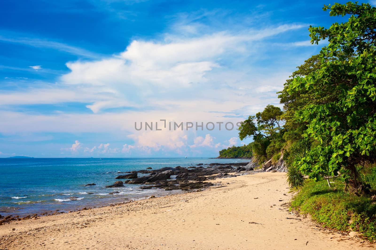 sunny beach with rocks and jungle, Thailand