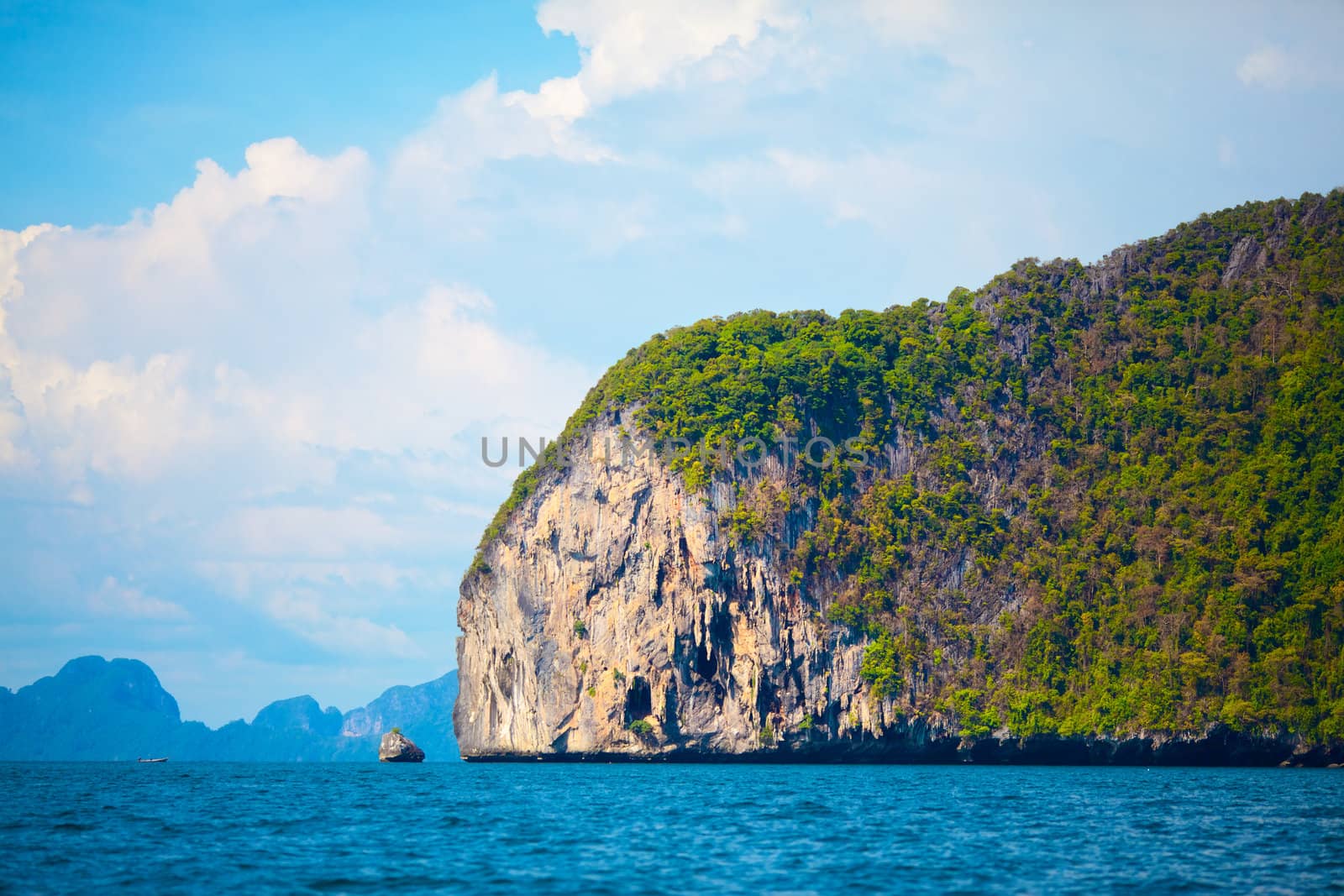 tall cliff with trees at Andaman Sea, Thailand