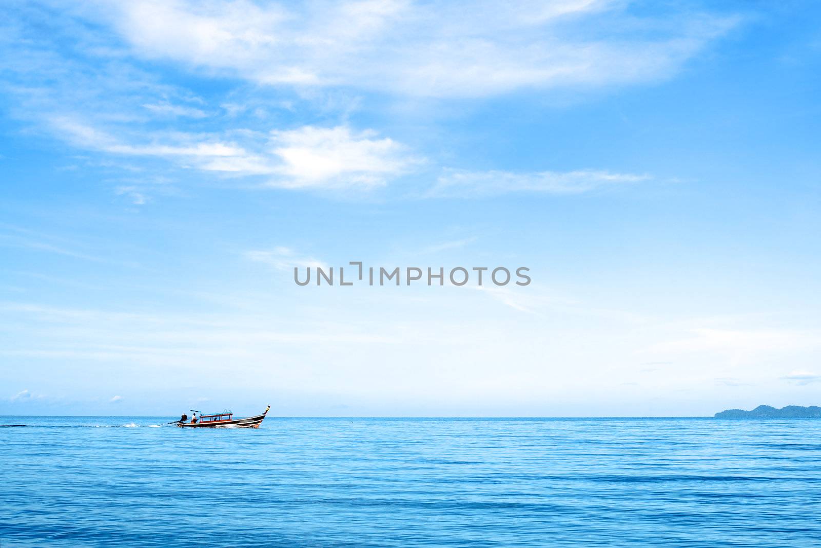 seascape with boat and rocks, Andaman Sea, Thailand