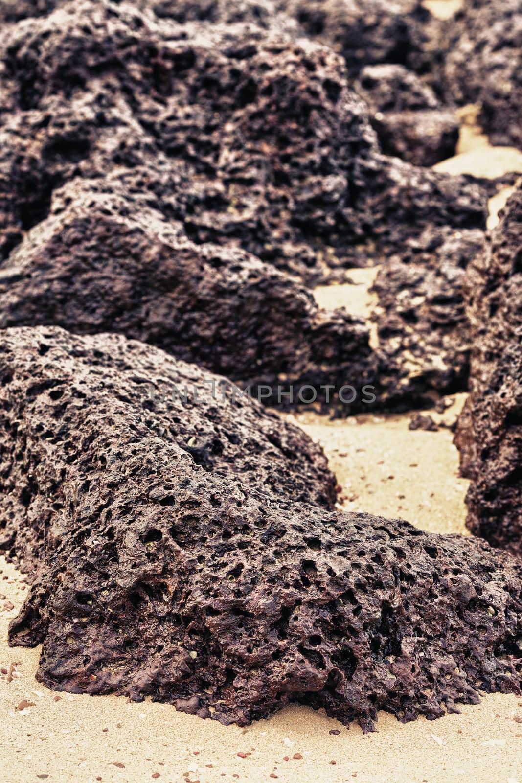 rocks and sand on shore, Thailand, close up
