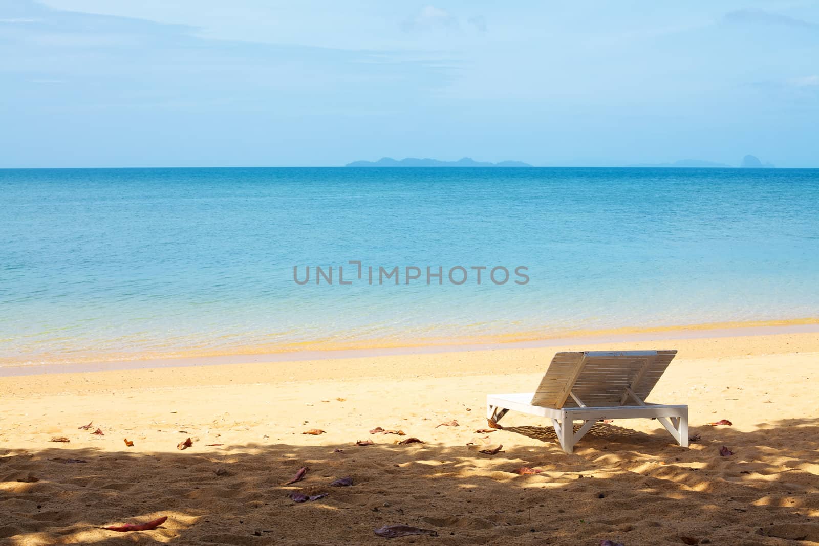 Chaise lounge on a beach by petr_malyshev