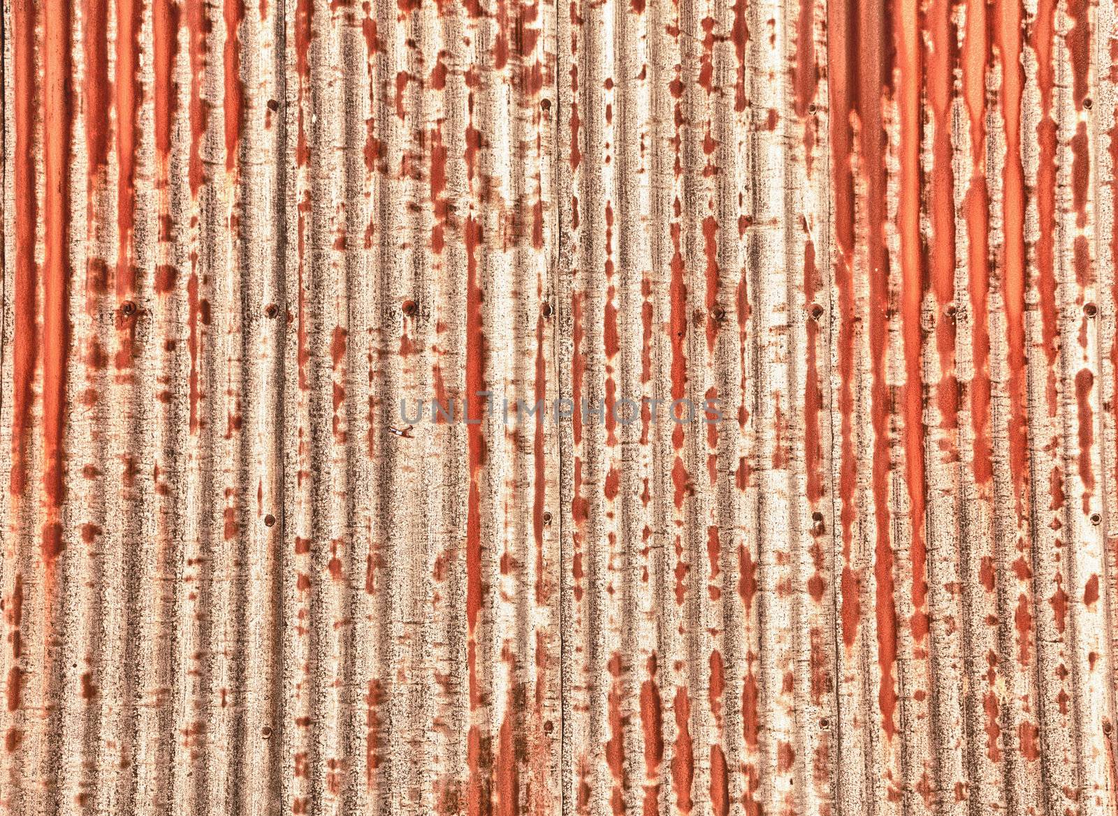 Close up of a sheet of corrugated metal rusting and processed in HDR