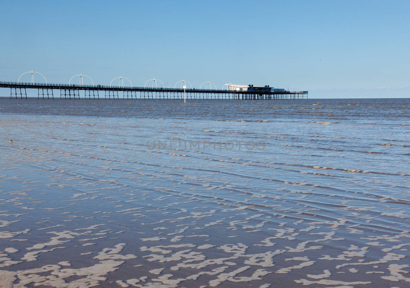Unusual combination of high tide floods the beach at Southport