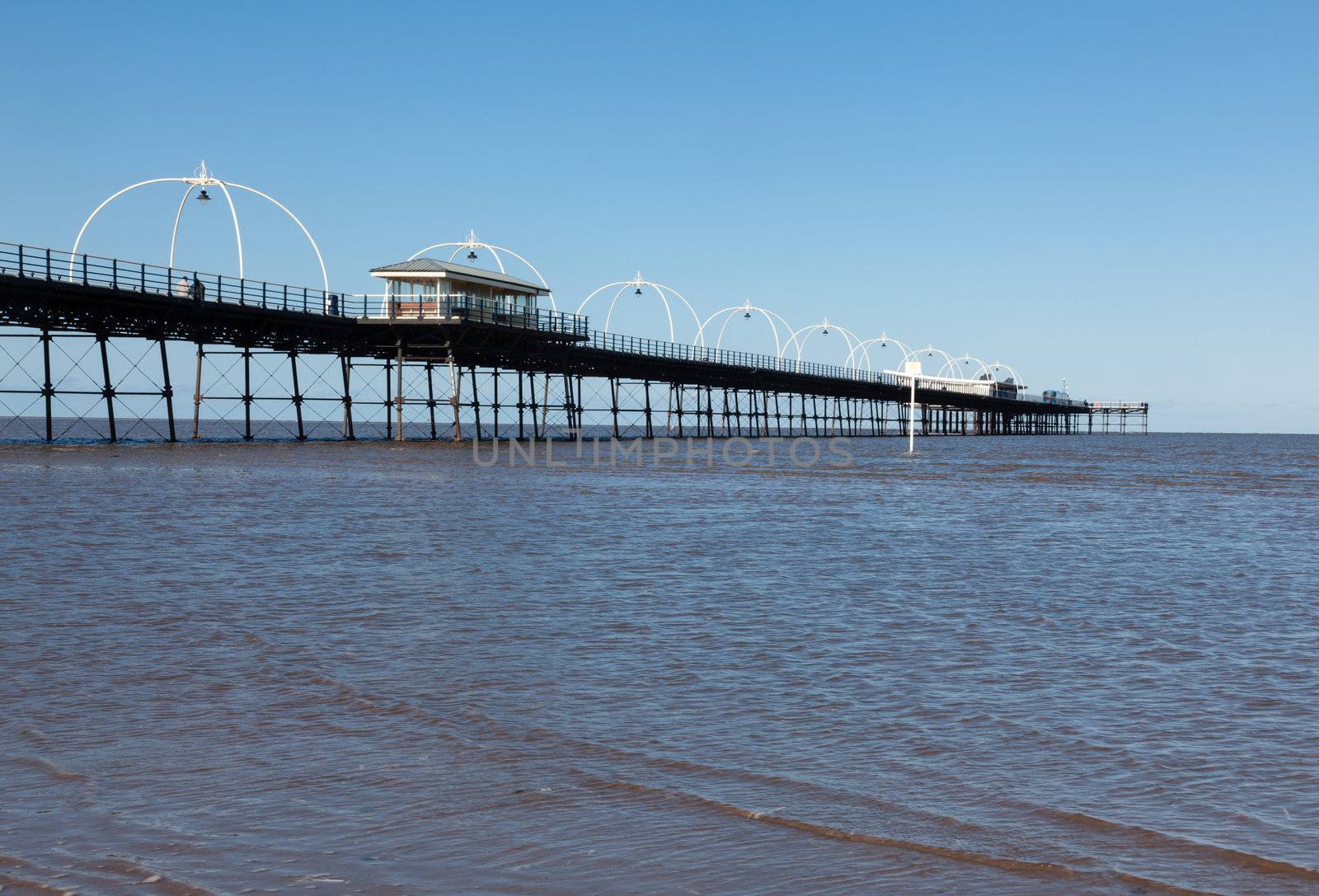 Unusual combination of high tide floods the beach at Southport