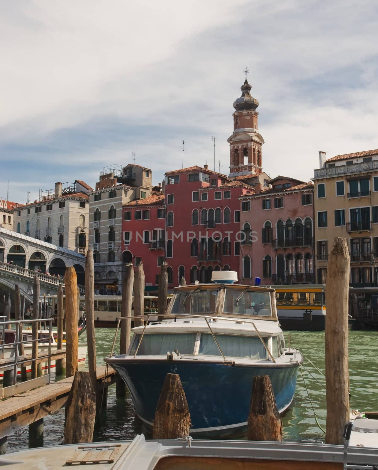 Motor boat at the pier in Venice near Rialto Bridge