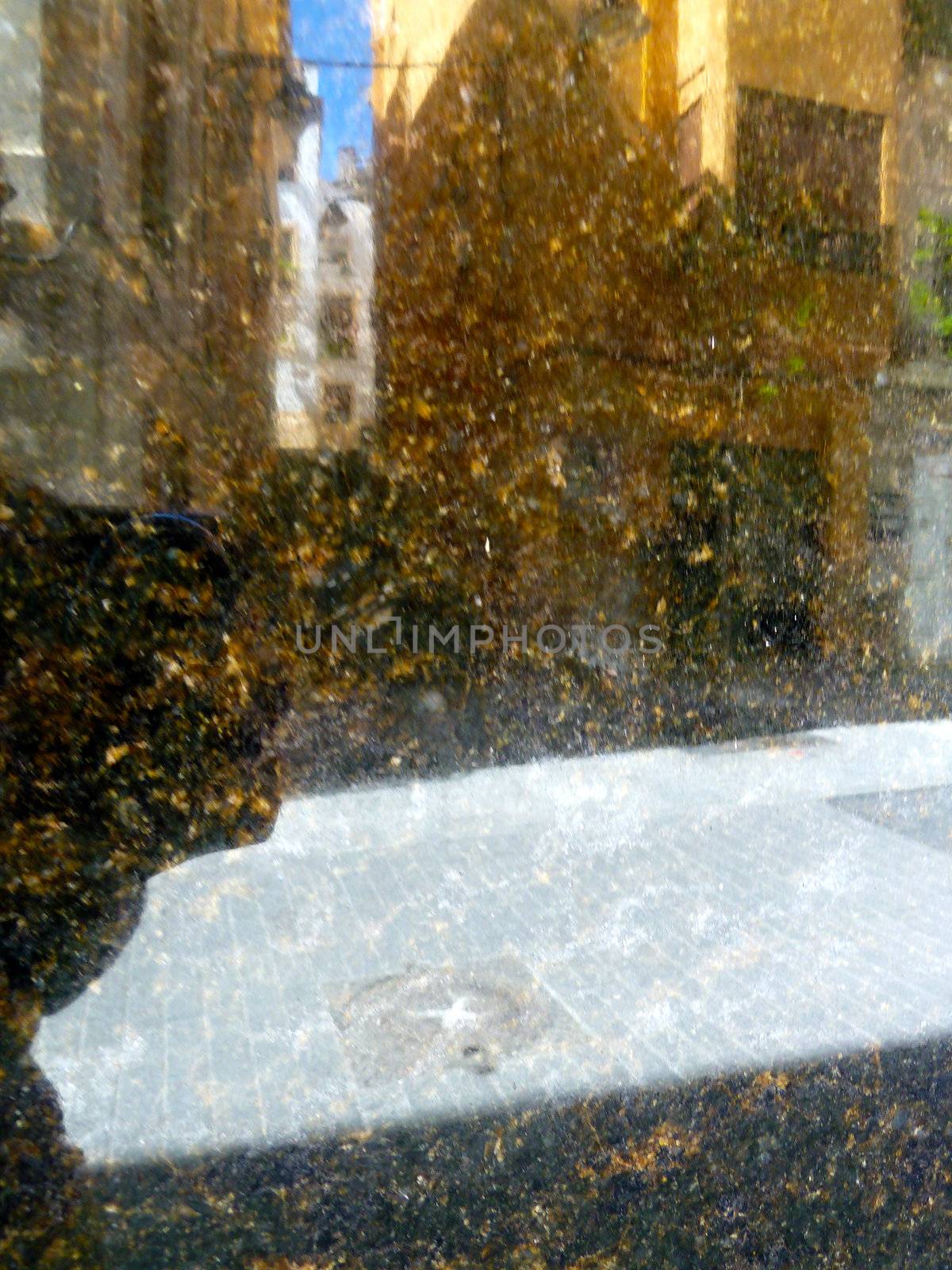 reflection on a gold colored stone surface