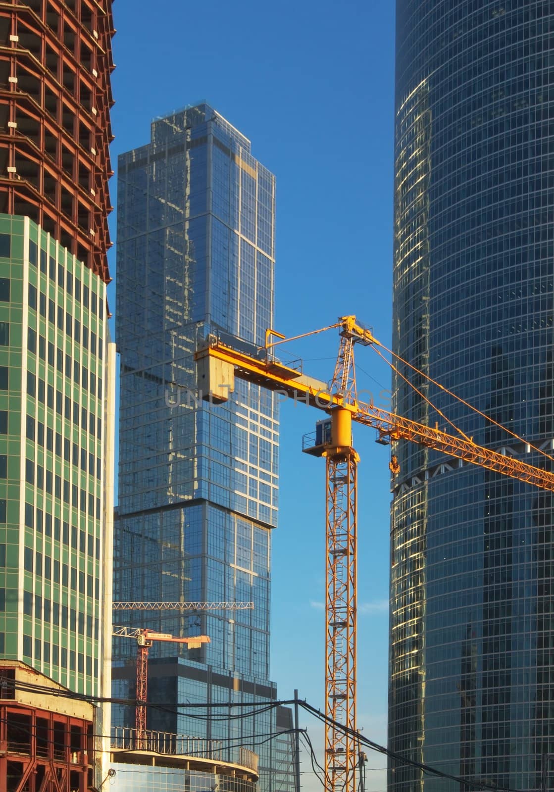 The lifting crane and buildings by glassbear