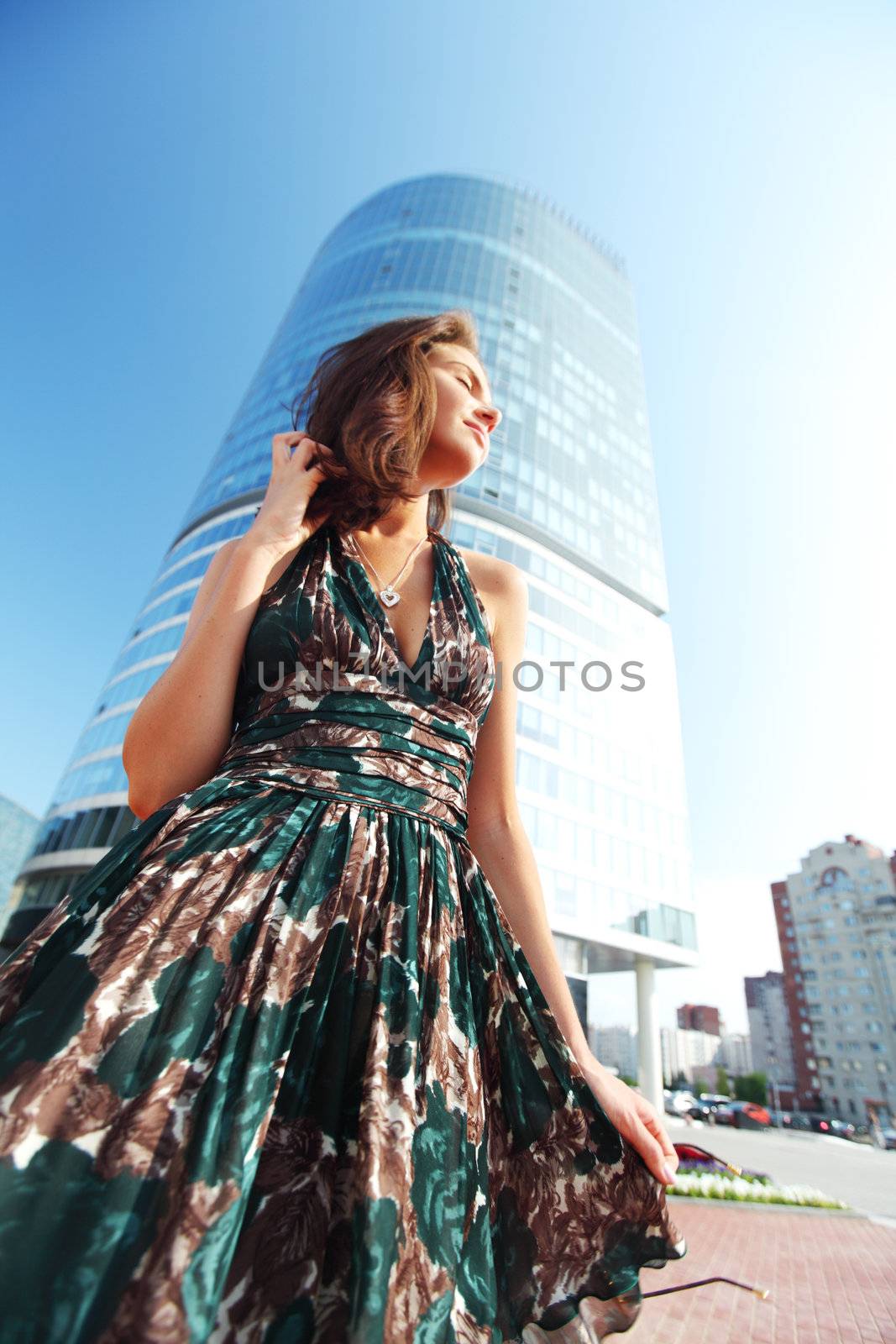  glamorous girl in the background of a skyscraper