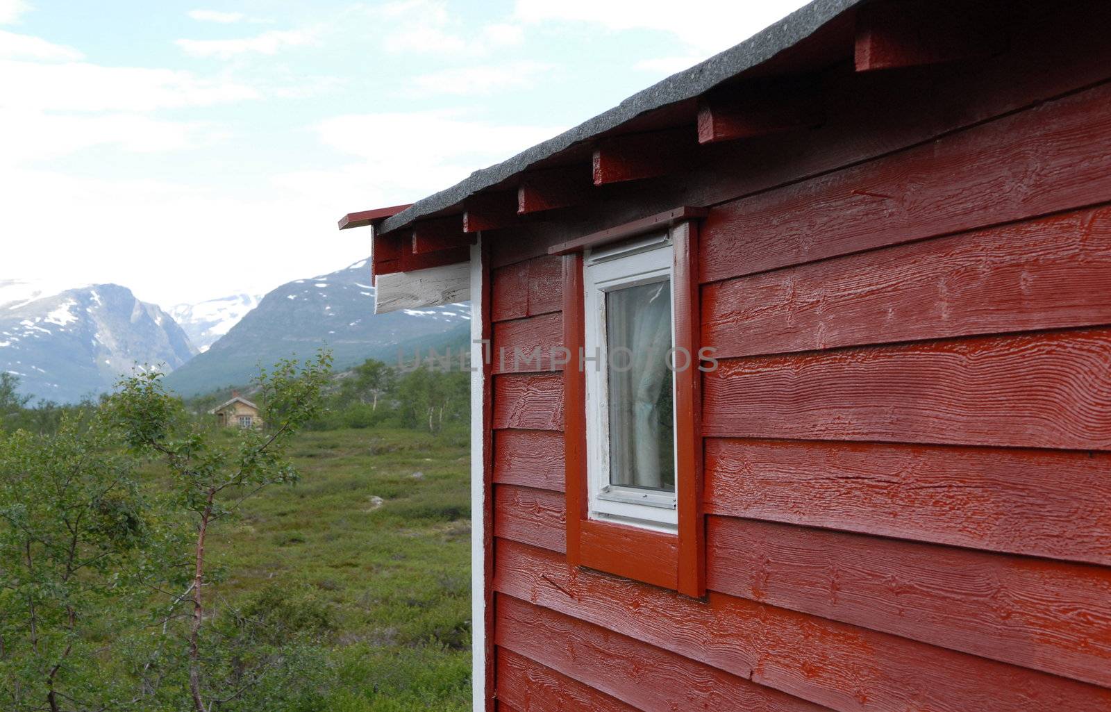 Small red cabin in Norwegian mountain