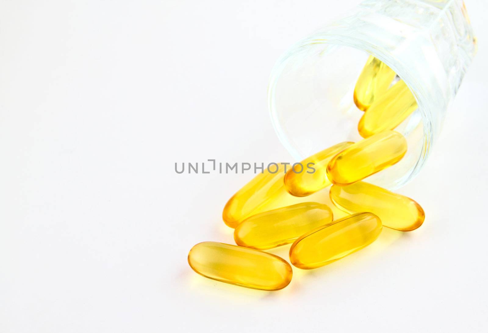 vitamins in glass on white background  by nuchylee