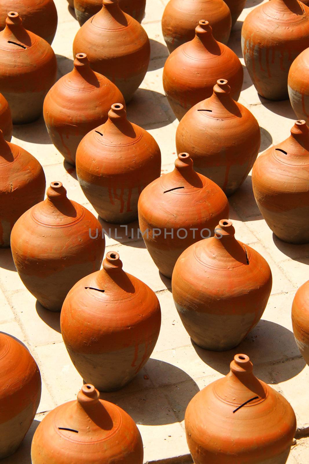 Many clay vases kept for drying   by nuchylee