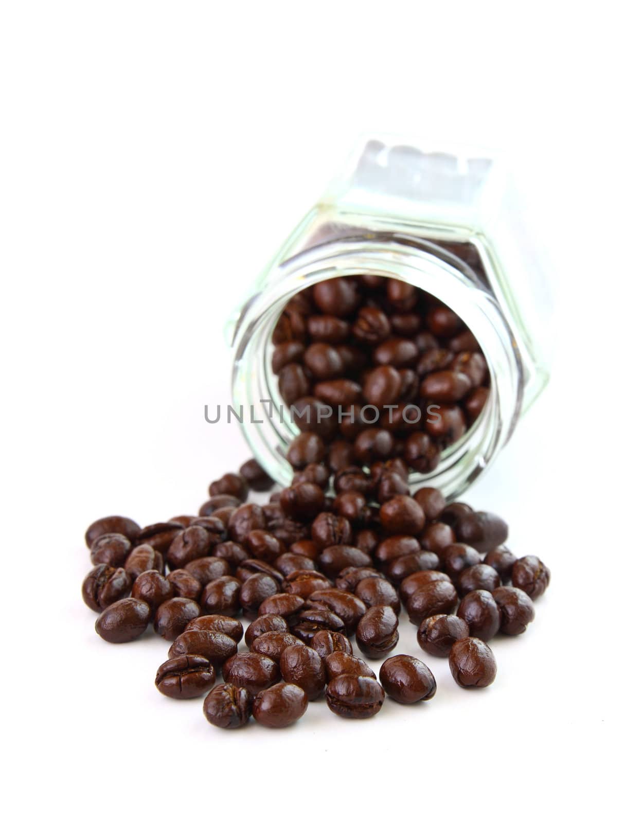 Coffee beans in a glass jar on white background  by nuchylee