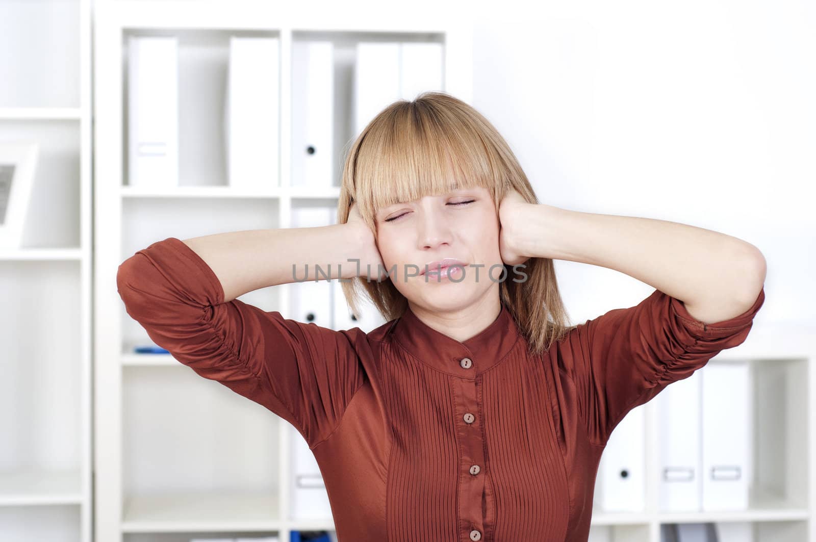 portrait of a beautiful woman who holds her head