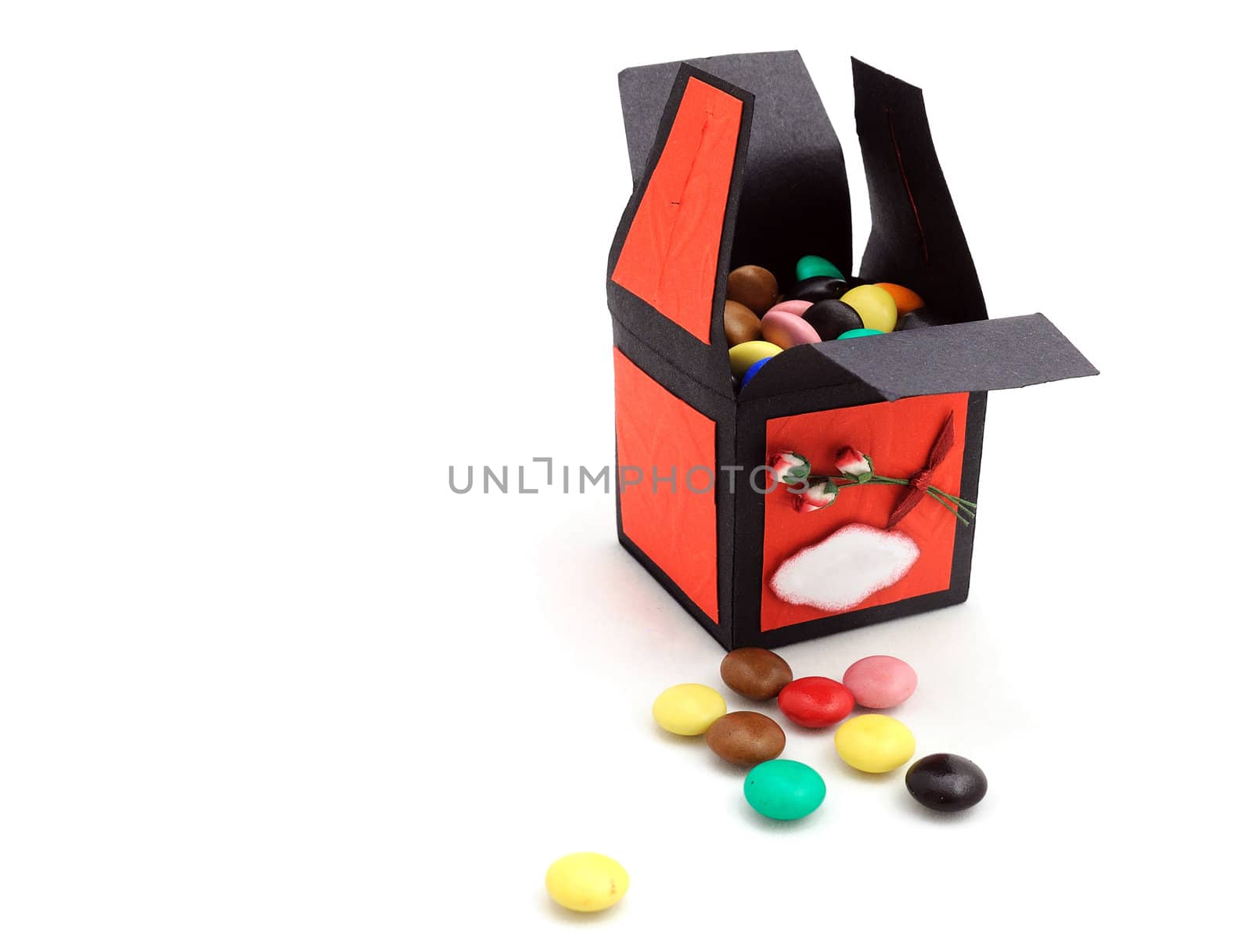 decorative bonbonniere with sweets in it and near