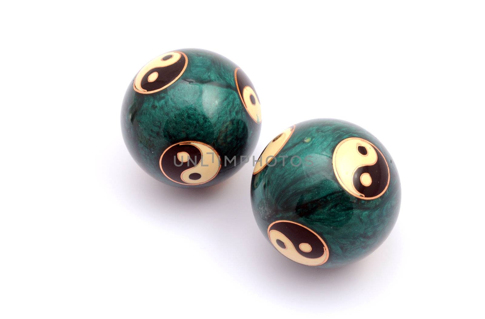 Green Chinese balls for relaxation on white background
