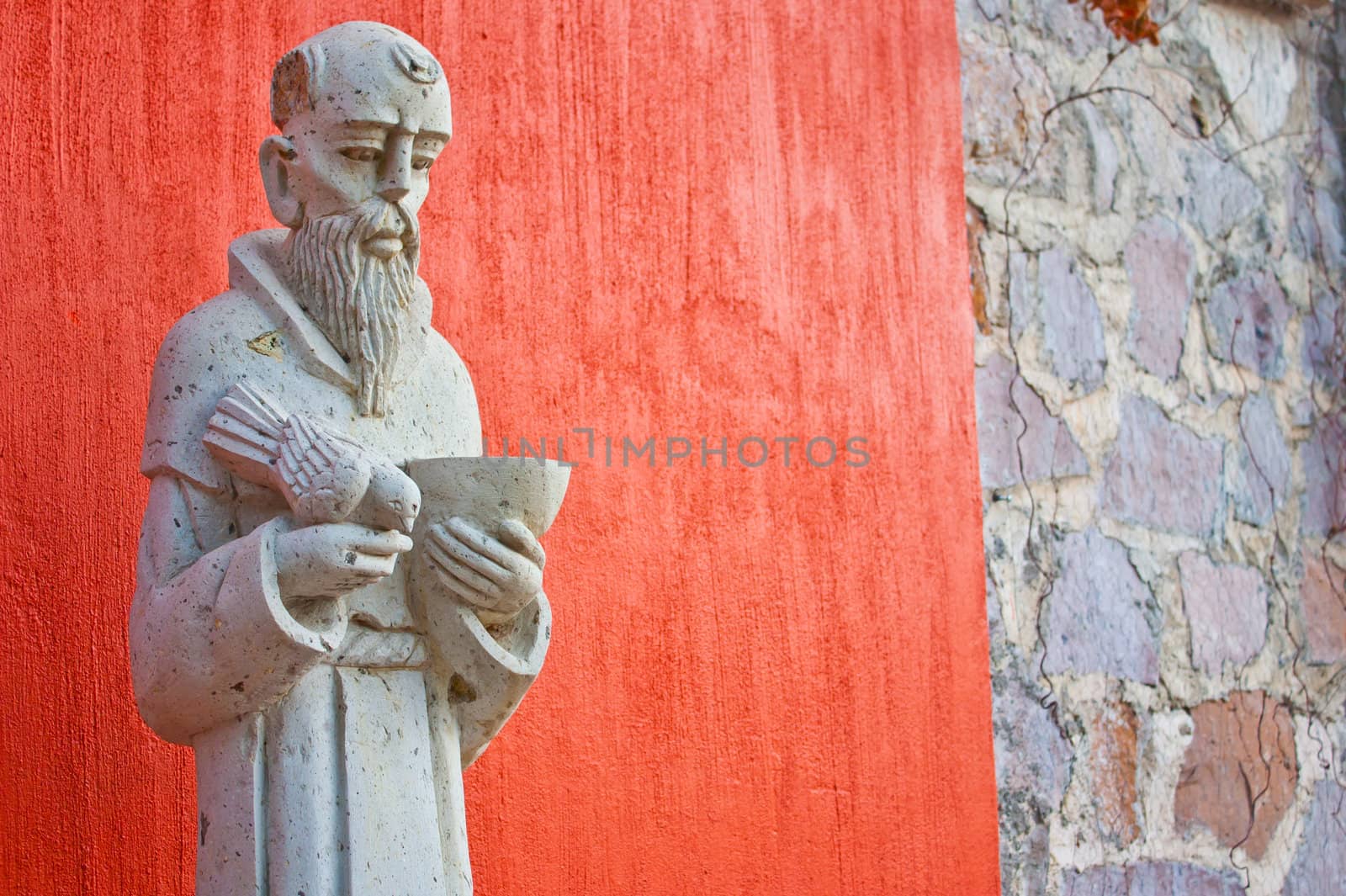 Saint Francis statue at the entrance of a Mexican church