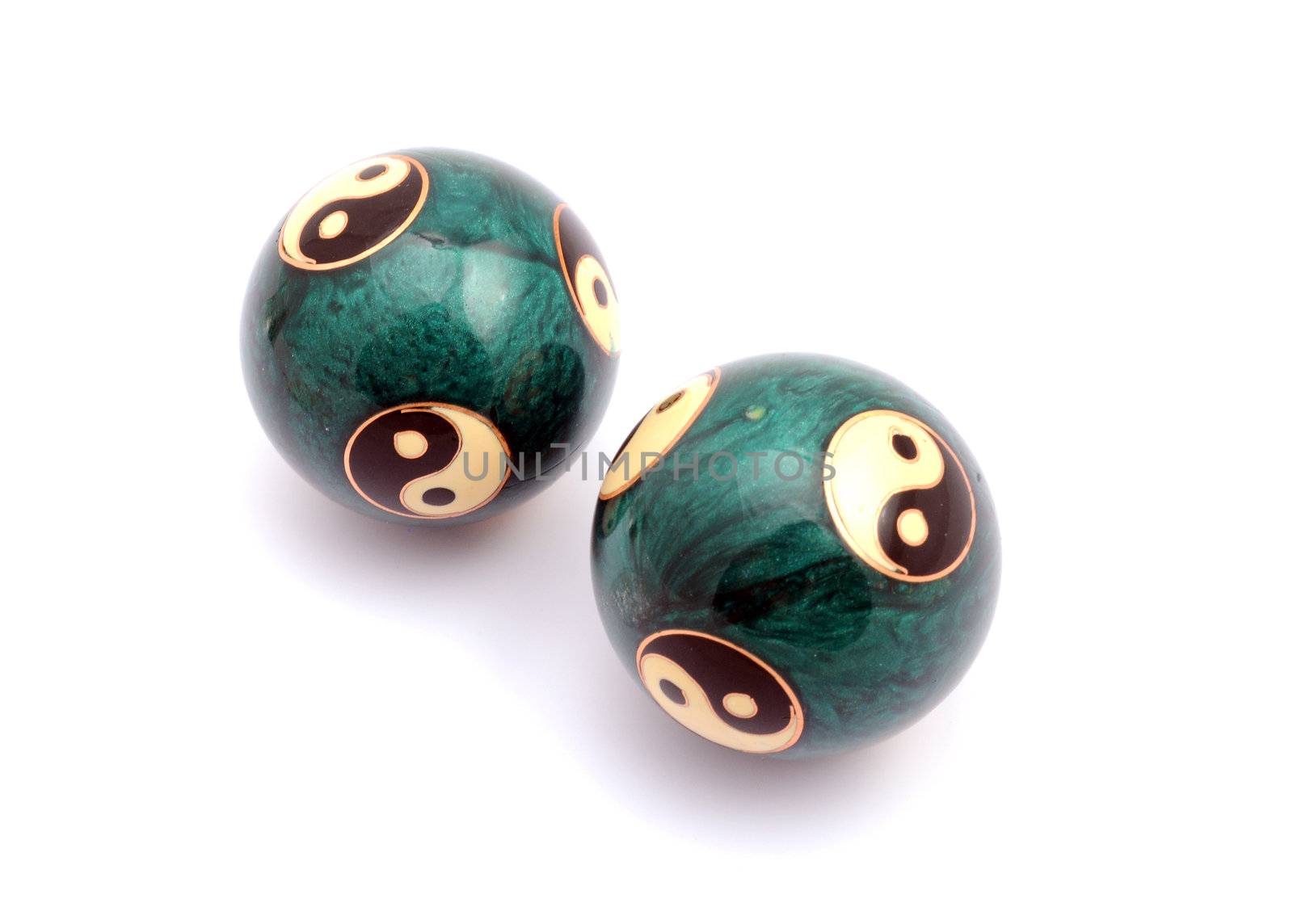 Green Chinese balls for relaxation on white background
