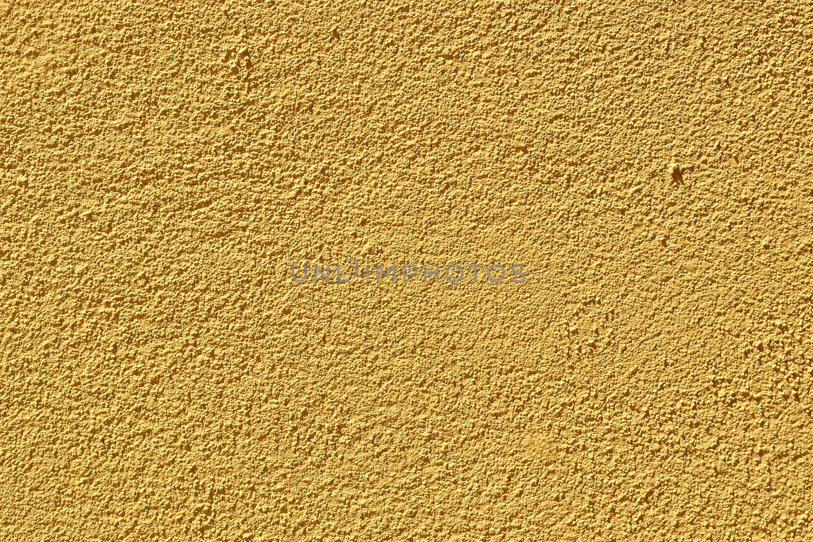 A yellow plaster wall texture / background.
