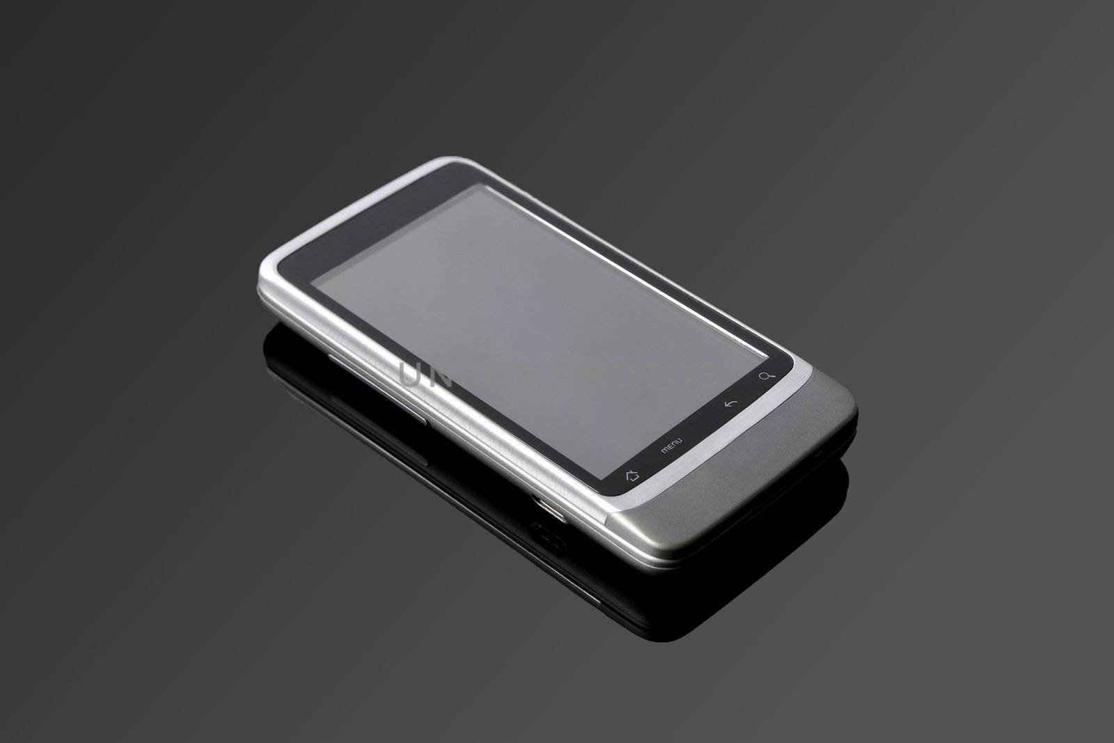 An Android mobile phone on a black glass table