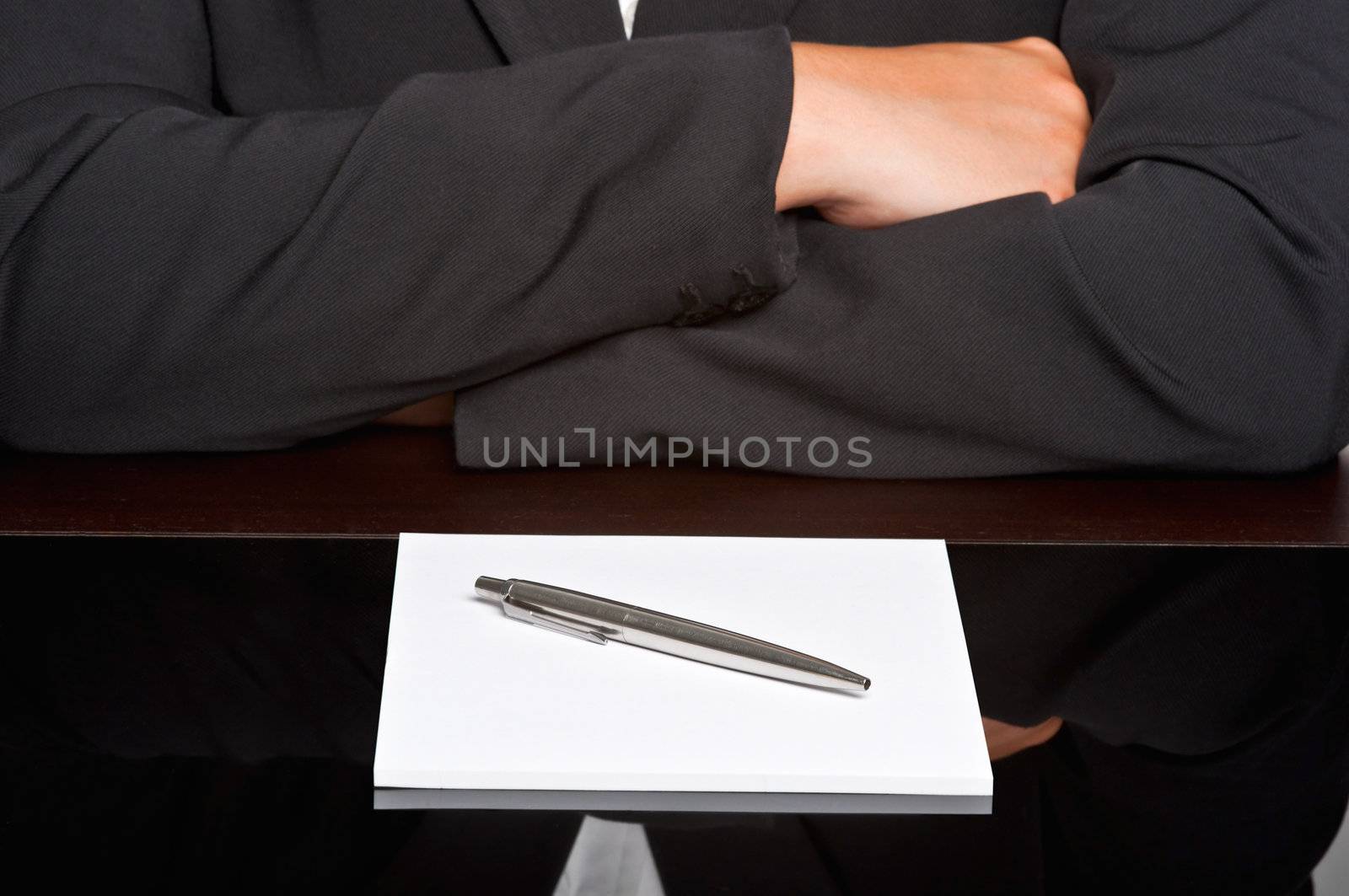 Businessman with arms crossed in a meeting