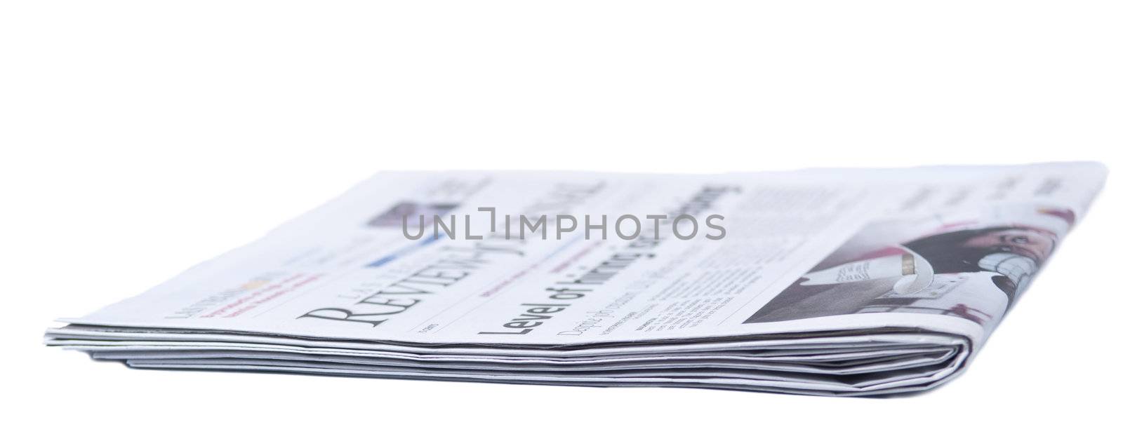 Newspaper folded on a white background