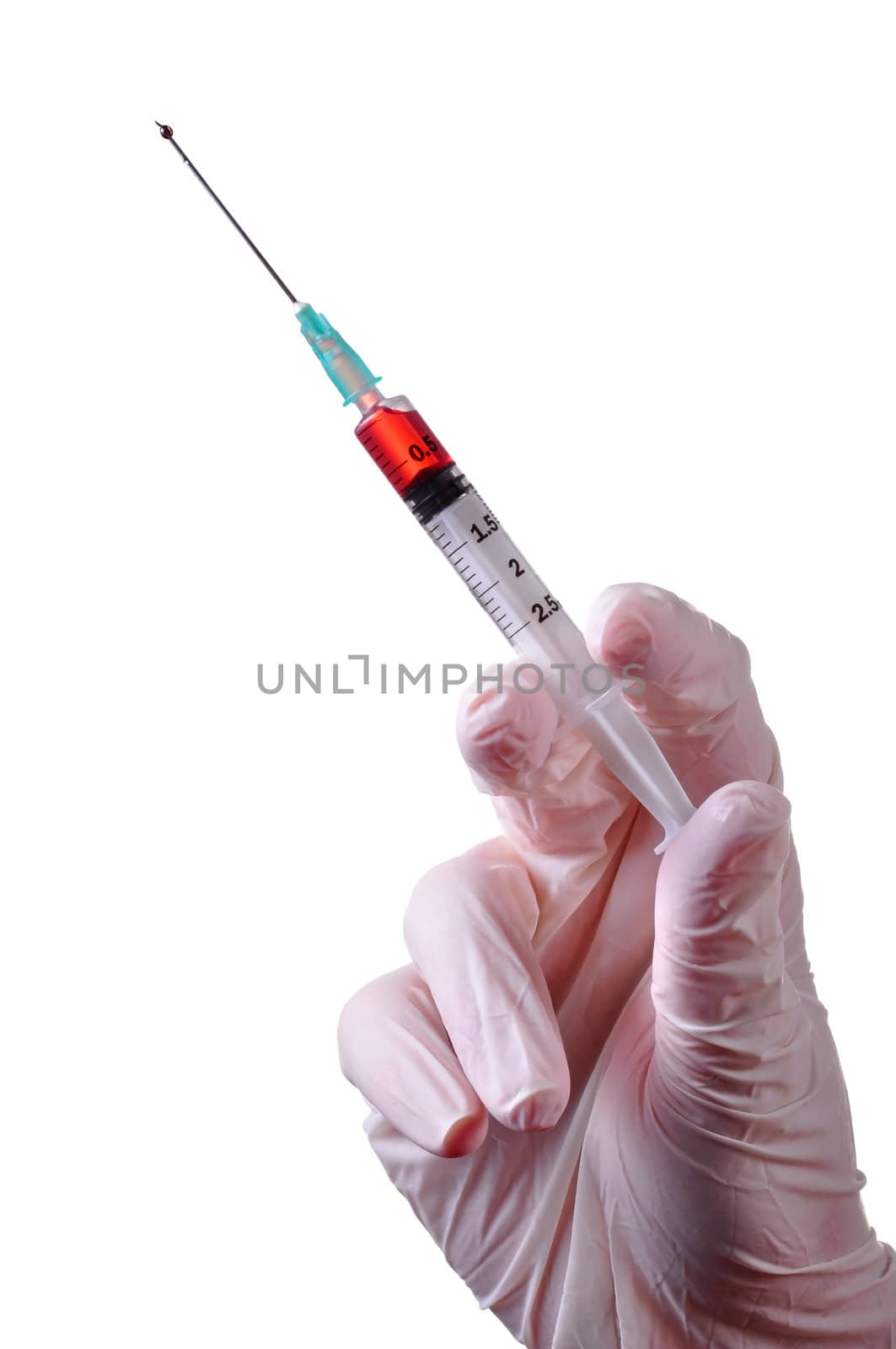 Hand with latex glove holding a syringe with a red liquid inside. Isolated.