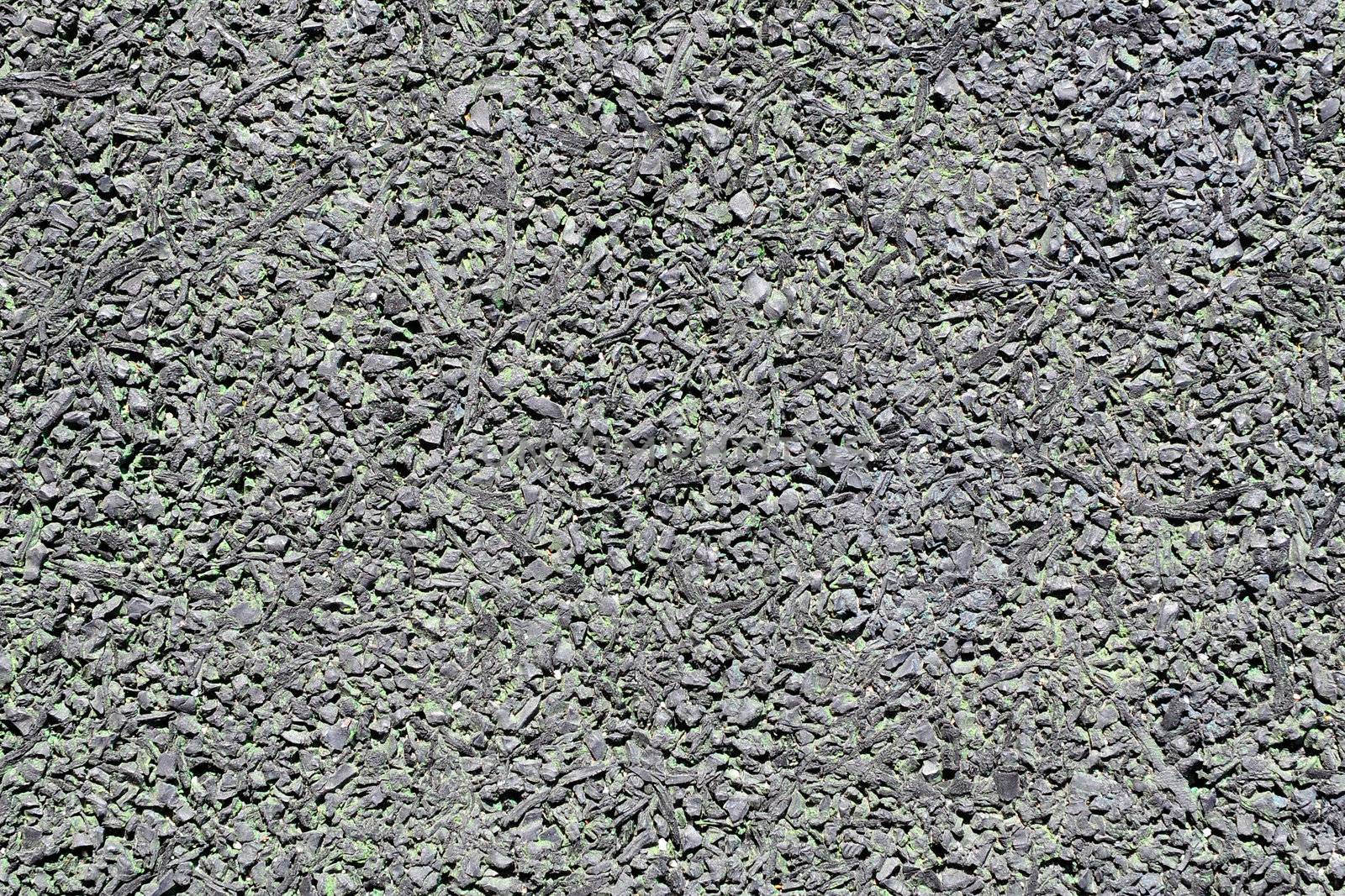 Rubberized floor texture. A type of sustainable flooring that can be produced from recycled tires.