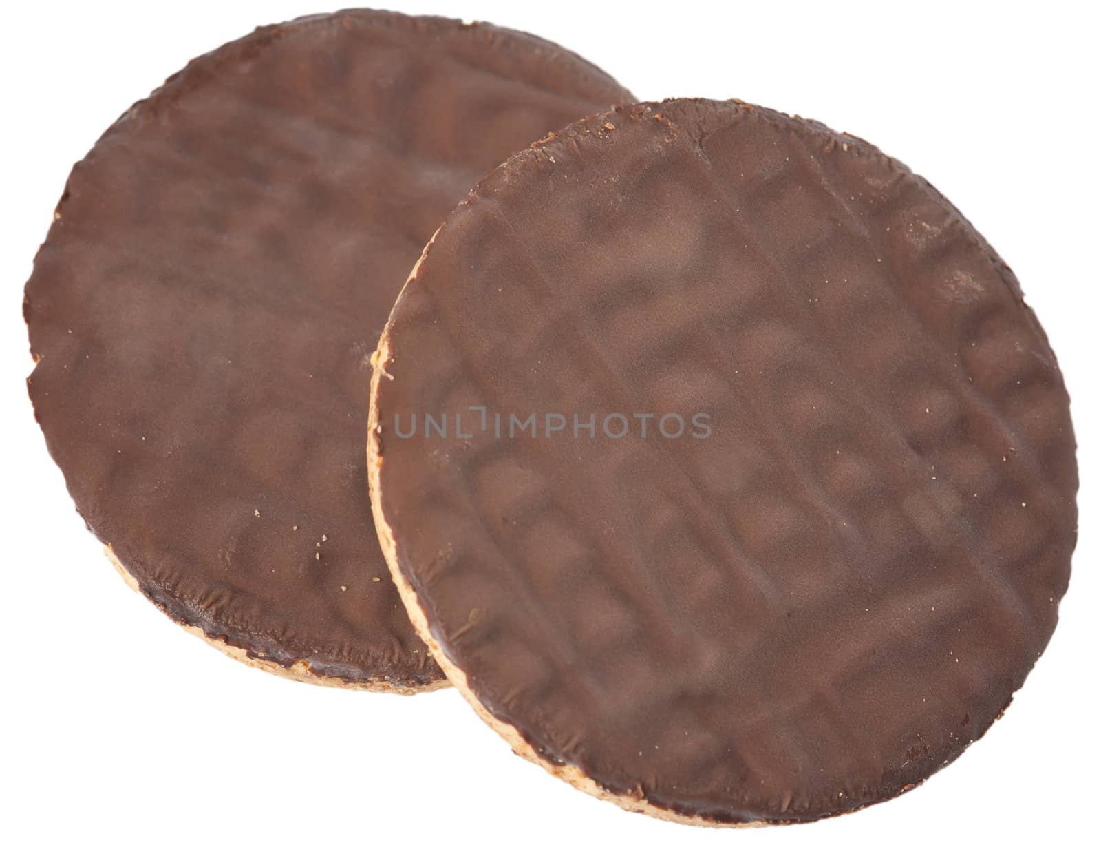 Two chocolate cookies on a white background