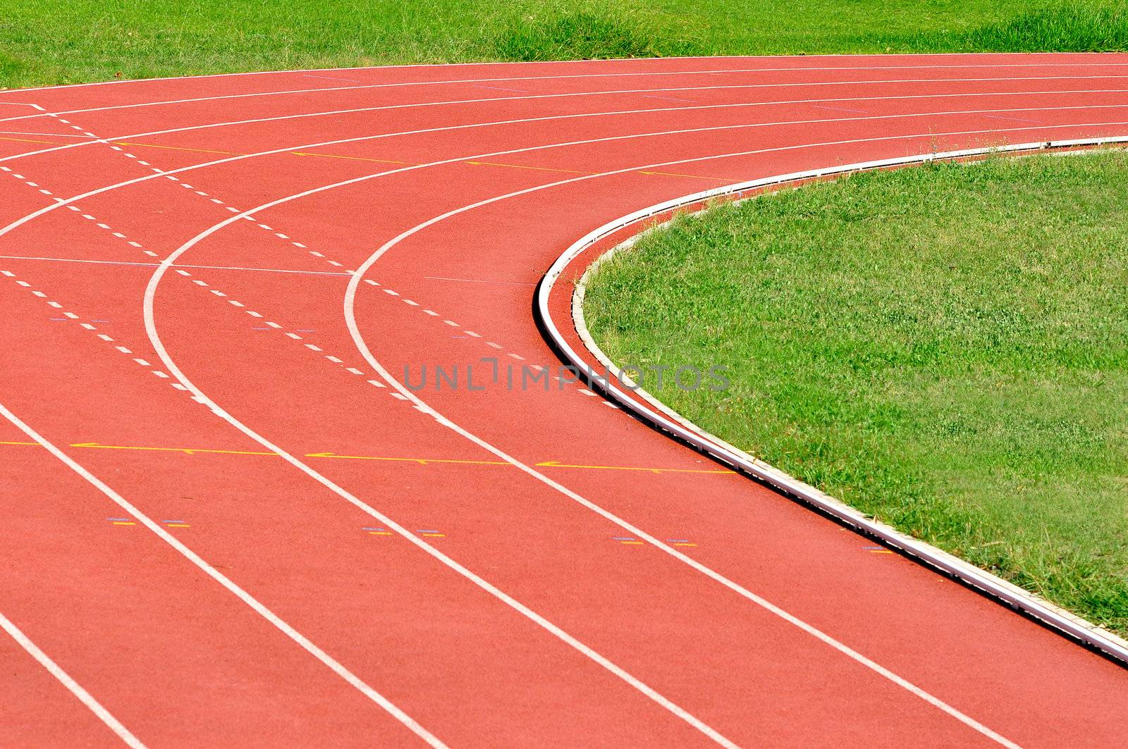 Details of an athletics running track, turning right
