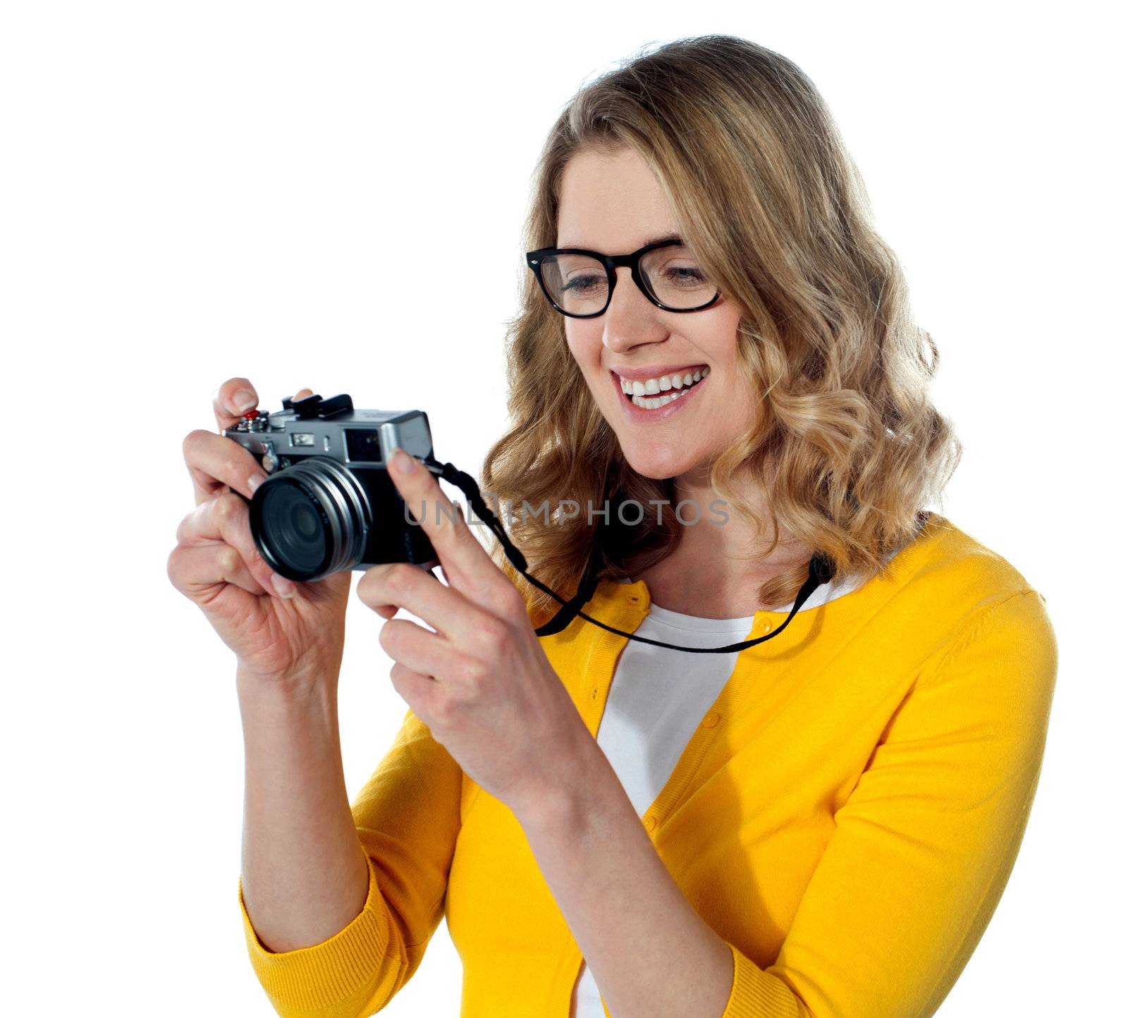 Female photographer with a camera by stockyimages