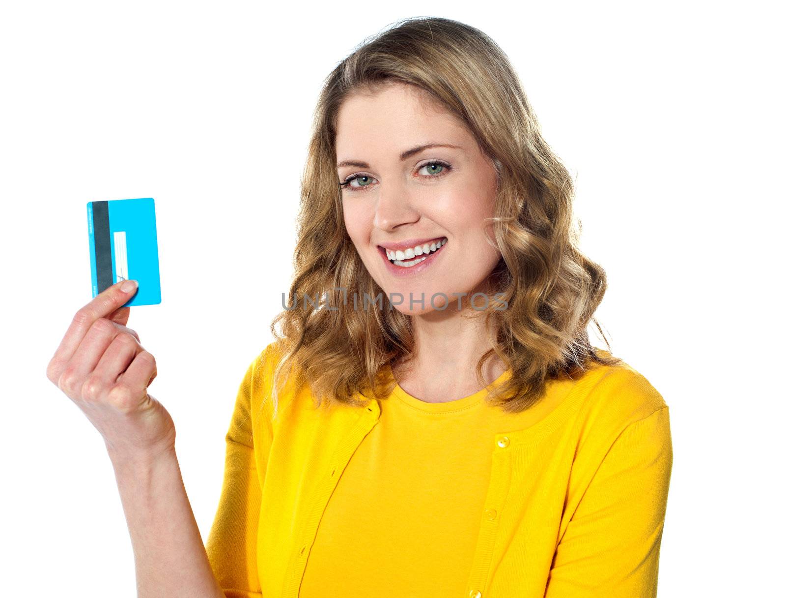 Close-up portrait of young smiling businesswoman holding credit card isolated on white background